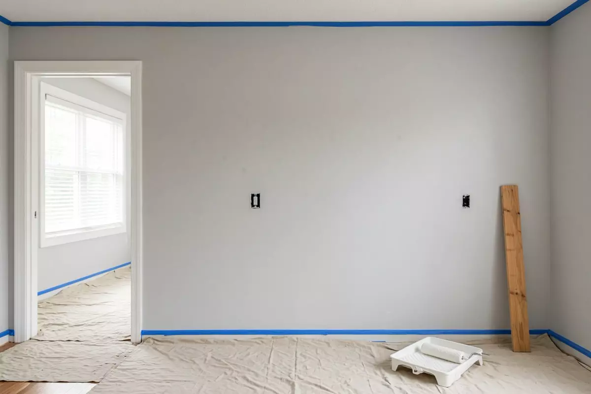 An empty room prepped for paint.